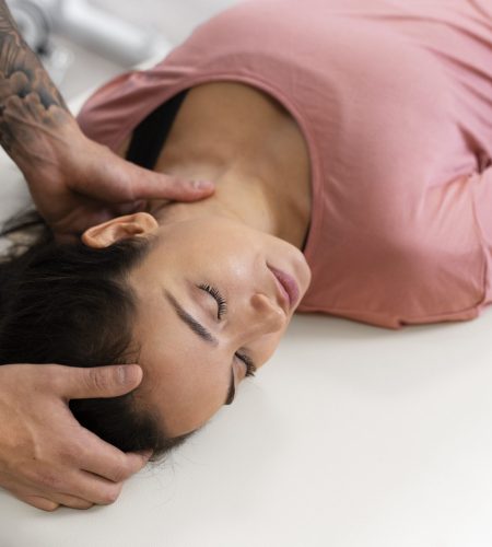 close up physiotherapist helping patient